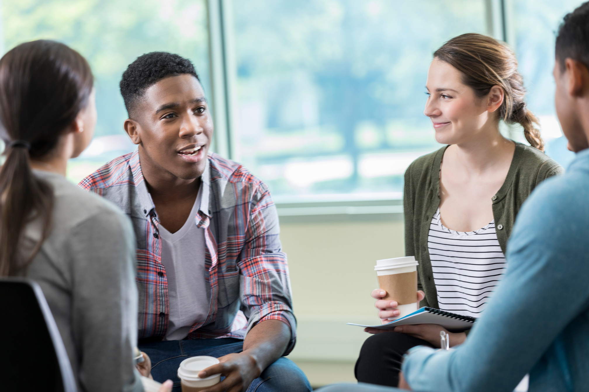 Young adults discuss issues in support group meeting