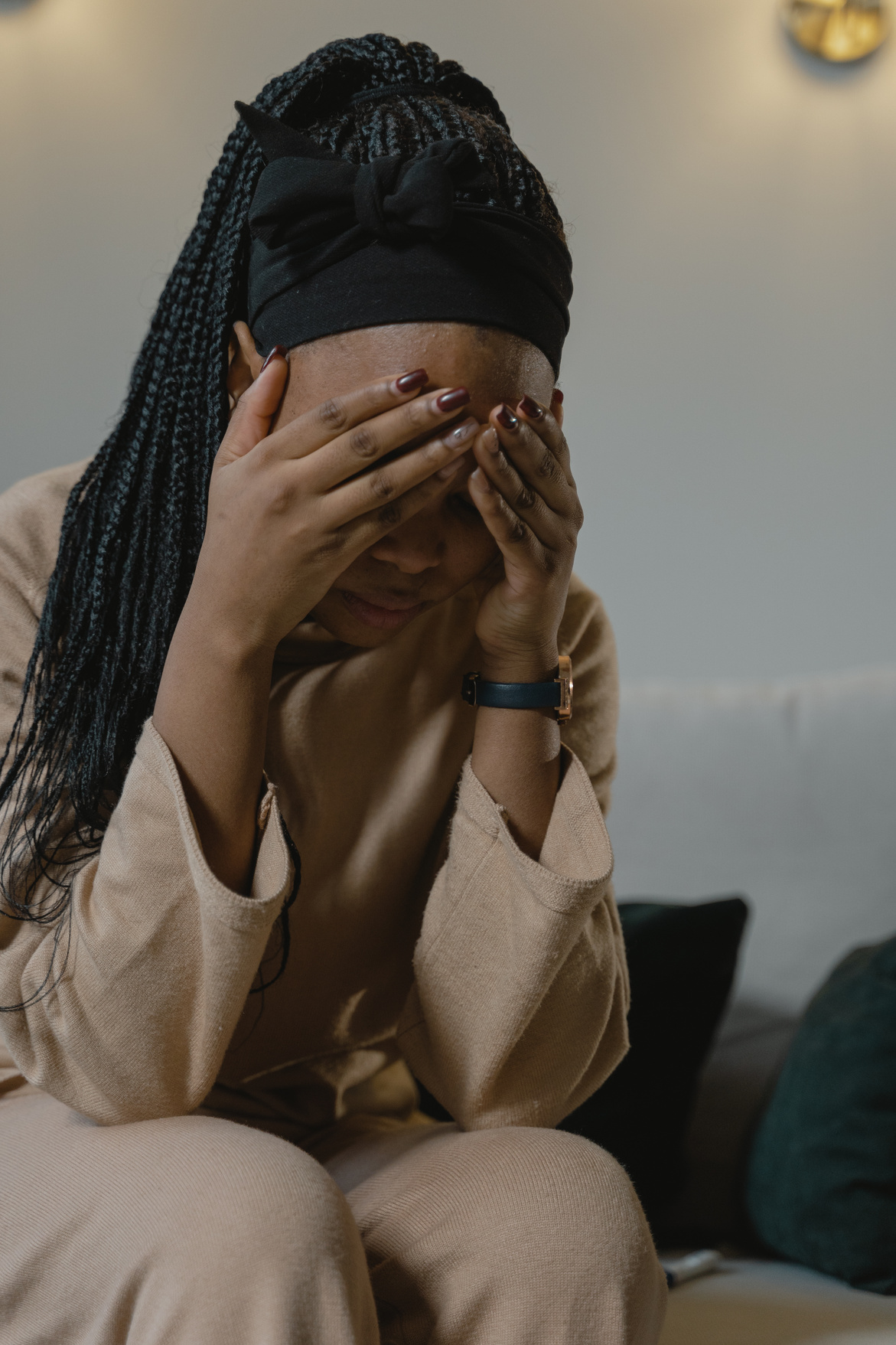 A Woman Covering her Face